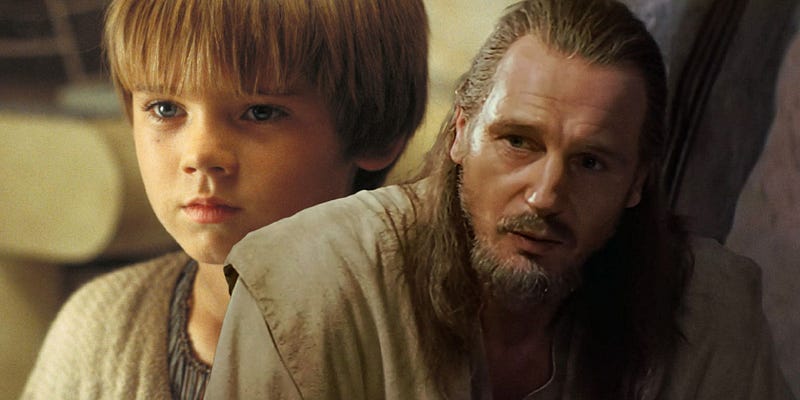 Qui-Gon Jinn speaking with young Anakin Skywalker outside Watto’s shop in The Phantom Menace (1999)