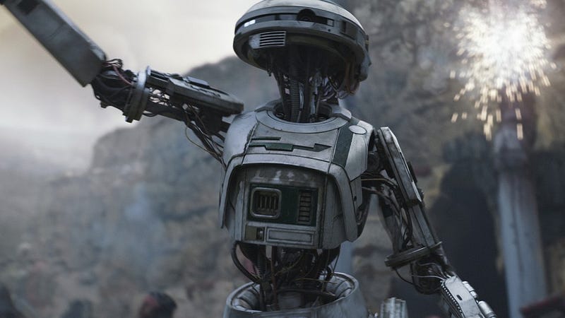 L3–37 leading the Kessel uprising in Solo: A Star Wars Story (2018) — fist raised, surrounded by freed droids.